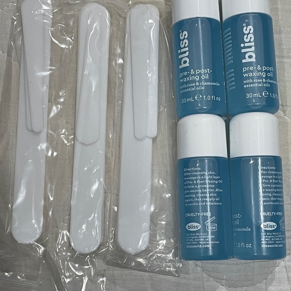 Bliss Blue Pre & Post Waxing Oils and large and small spatulas